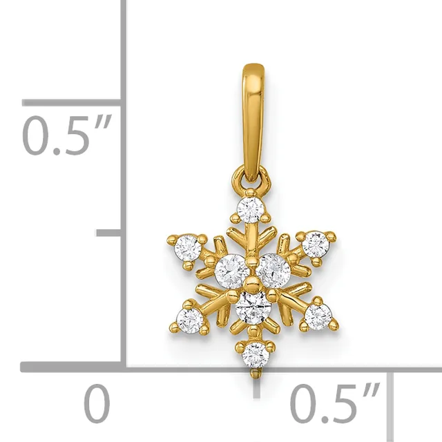 Gold snowflake pendant with round white cubic zirconia stones at each point and center, shown against a measurement scale indicating approximately 0.5 inches in width and height.