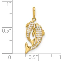 Gold dolphin pendant with cubic zirconia stones covering the body, shown next to a ruler indicating it is approximately one inch tall.