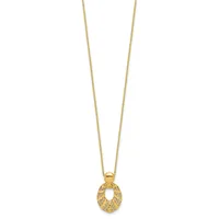 Gold-toned pendant necklace with a textured oval charm hanging from a delicate chain.