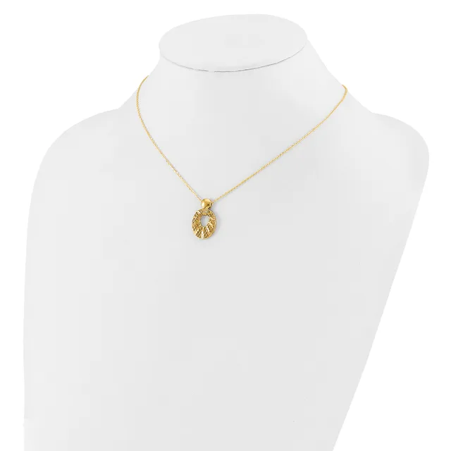 Gold-toned leaf-shaped pendant necklace displayed on a white mannequin bust.