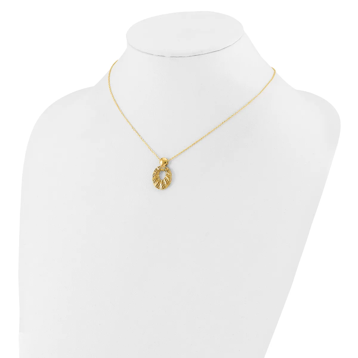 Gold-toned leaf-shaped pendant necklace displayed on a white mannequin bust.