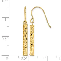 Pair of gold textured cylindrical drop earrings with fish hook closures, displayed next to a ruler showing approximately 1.5 inches in length.