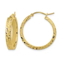 A pair of gold hoop earrings with textured diagonal line patterns on the outer surface, shown from front and side views.