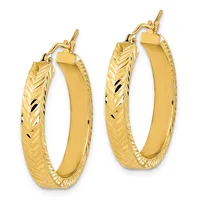 A pair of gold hoop earrings with textured chevron patterns on the outer edges and polished flat inner surfaces, shown at two different sizes.