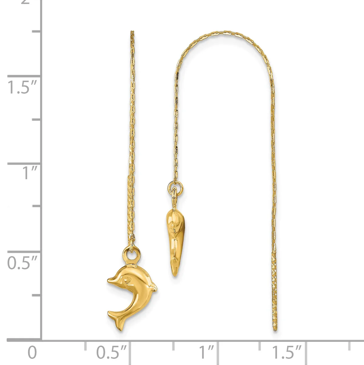 Two gold threader earrings displayed against a measurement scale: one featuring a dolphin charm and one with an elongated cone-shaped pendant.