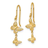 Pair of gold-toned dangle earrings with filigree butterfly charms connected by delicate chains, displayed against a white background.