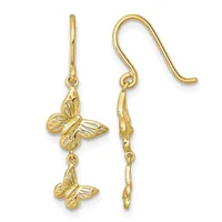 Pair of gold dangle earrings with two butterfly charms each, suspended from hook-style ear wires.