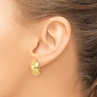A polished gold curved earring with a post back worn on a person's earlobe, shown from the side view.