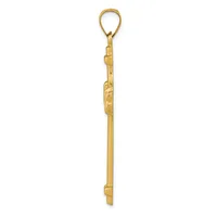 A long, narrow gold pendant with decorative carved details along the shaft and a loop at the top for hanging.
