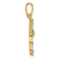 Gold flute charm pendant with loop bail and small diamond accents along the body, shown against a white background.