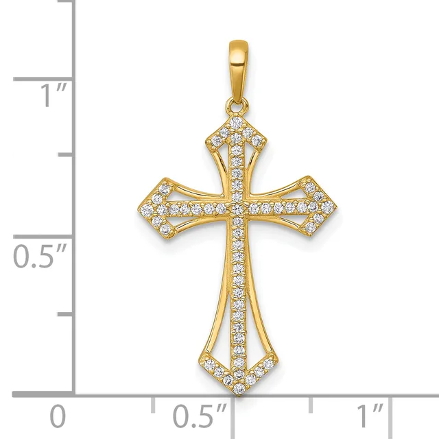 Gold cross pendant with cubic zirconia stones set throughout, displayed against a measurement scale showing approximately one inch in height.