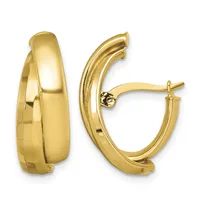 Pair of polished gold-toned chunky curved hoop earrings with posts and backs, shown from front and side angles.