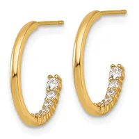 Pair of gold hoop earrings with curved polished tubing and a section lined with round cubic zirconia stones along the bottom inner curve.