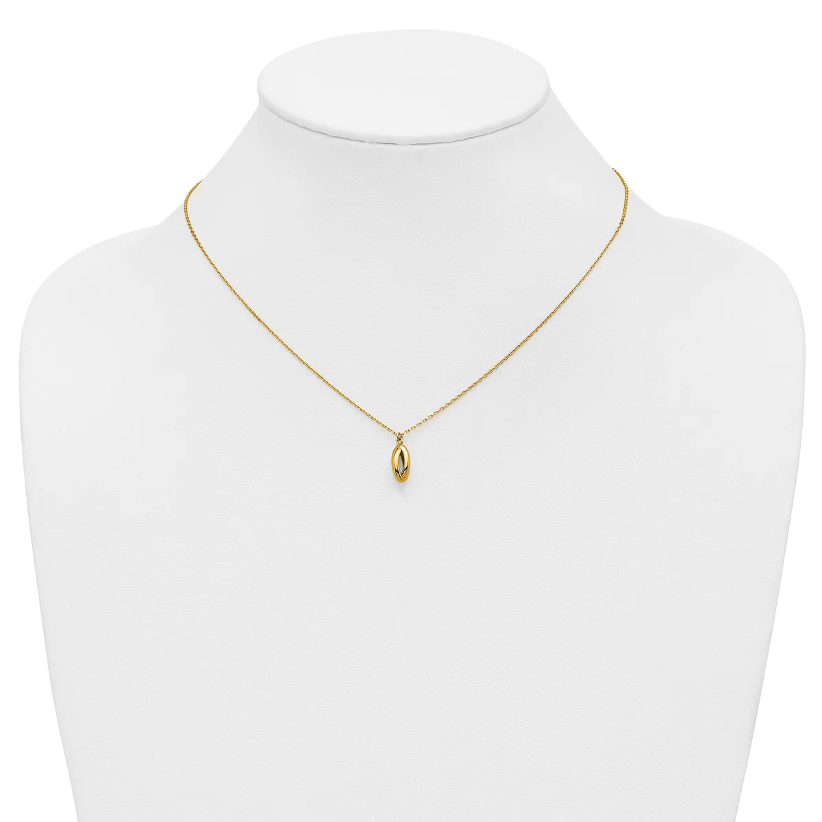 A gold-toned delicate chain necklace with a small polished oval pendant, displayed on a white mannequin bust.