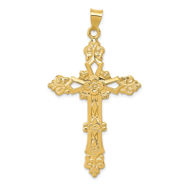 A gold ornate cross pendant with decorative floral motifs at each end and a small bail loop at the top.