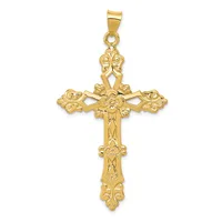 A gold ornate cross pendant with decorative floral motifs at each end and a small bail loop at the top.