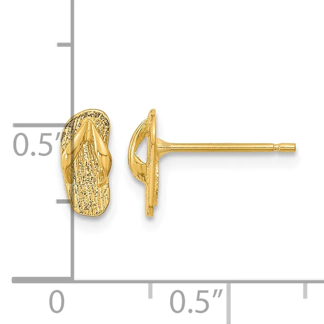 A pair of gold stud earrings shaped like corn on the cob with textured surfaces, displayed next to a ruler showing they are approximately half an inch in size.