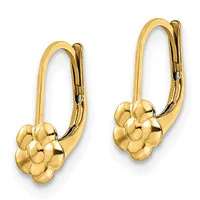A pair of gold-colored lever-back earrings with polished flower-shaped charms hanging from curved hooks.