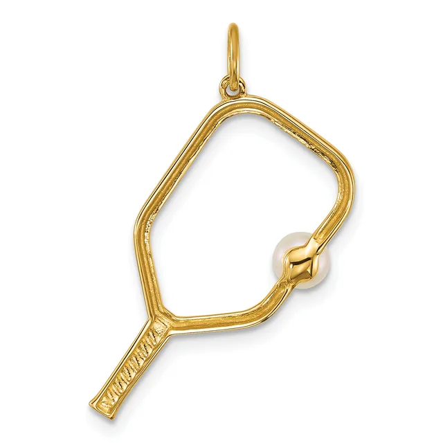 A gold-toned metal magnifying glass pendant with a loop handle at the top and a small pearl or white stone set into the frame.