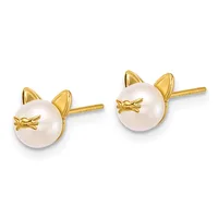 Pair of gold stud earrings featuring white pearl spheres with gold cat-shaped tops and small bow details, shown from the front.