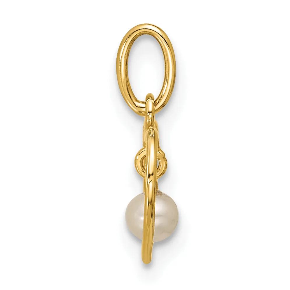 Gold oval keyring with a decorative knot detail and a round cream-colored pearl hanging from the bottom.