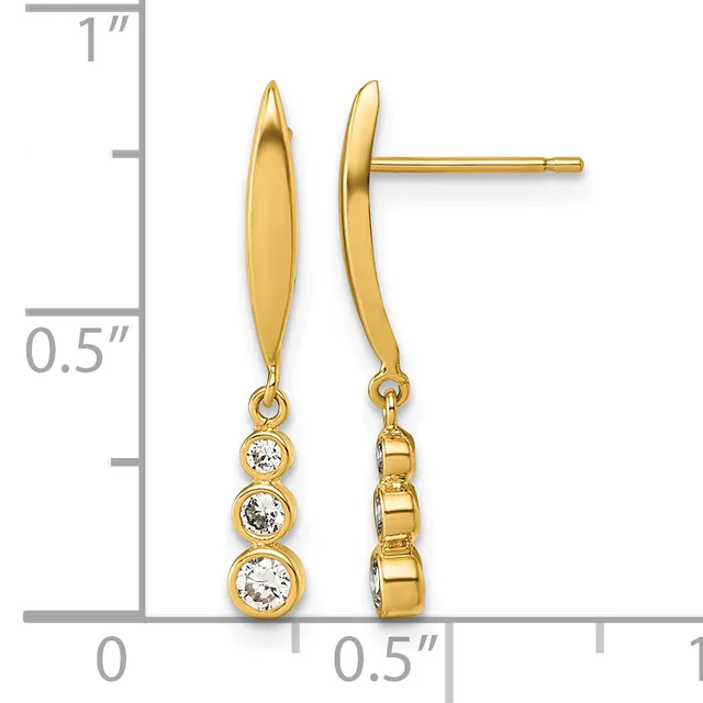 Gold drop earrings with polished oval tops and three stacked round cubic zirconia stones suspended below, shown against a ruler measuring approximately one inch in length.