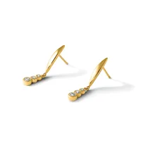 A pair of gold drop earrings with polished curved posts and three round diamond studs suspended below, shown against a white background.