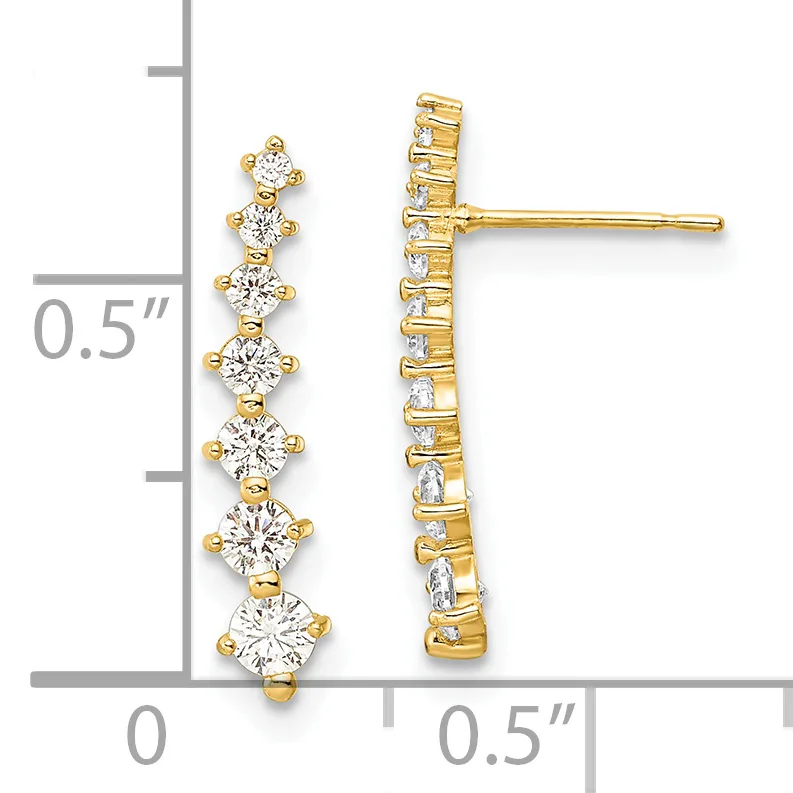 A pair of gold stud earrings with seven graduated round diamonds arranged vertically, shown next to a ruler for scale.