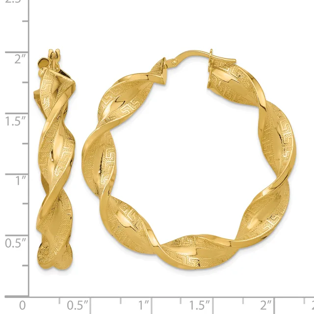 Gold twisted hoop earrings with a textured finish, shown next to a ruler measuring approximately 2 inches in length.
