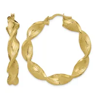 Pair of twisted gold hoop earrings with textured surfaces and a small stamped hallmark, shown from front and side angles.