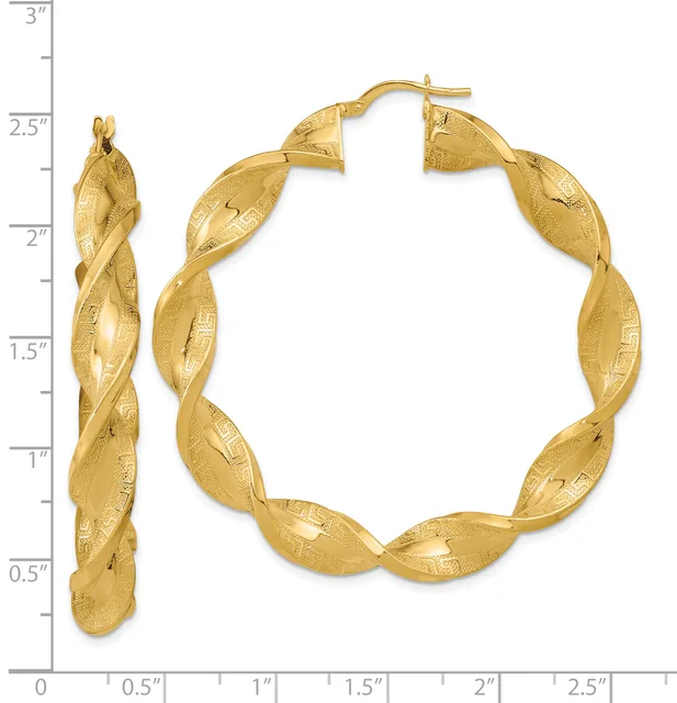 Gold twisted hoop earrings displayed next to a ruler showing their approximately 2.5-inch diameter, with a matching smaller twisted hoop earring shown on the left for scale.