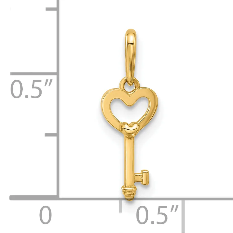 Gold-toned heart-shaped key pendant with a hollow heart outline at the top and solid shaft below, shown next to a measurement scale indicating approximately half an inch in height.