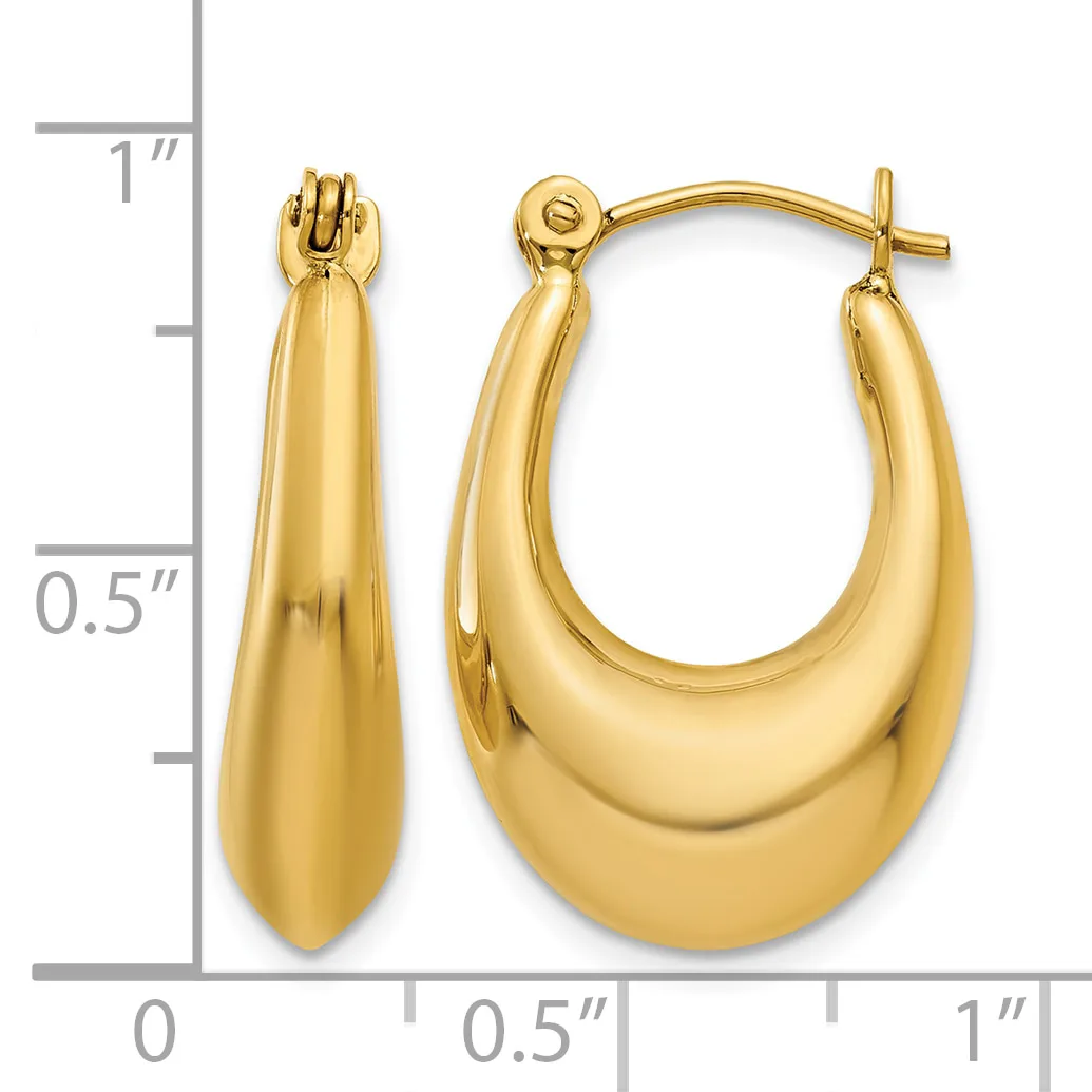 A pair of polished gold teardrop-shaped hoop earrings with post and clutch backs, displayed next to a ruler showing approximately one inch in length.
