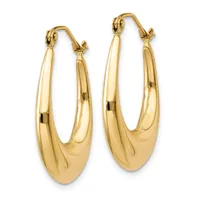 A pair of polished gold-toned hoop earrings with chunky, curved oval shapes and hinged closures, displayed against a white background.