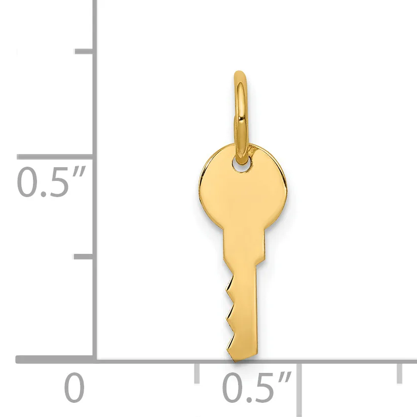 Gold-colored key charm with a loop at the top, shown next to a ruler indicating approximately 0.5 inches wide and 1 inch tall.