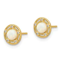 A pair of gold stud earrings featuring oval white opal centers surrounded by small round diamond accents in a decorative oval frame.