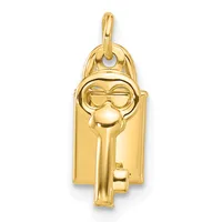 Gold pendant shaped like a key with a smiling face wearing sunglasses at the top, hanging from a rounded bail.