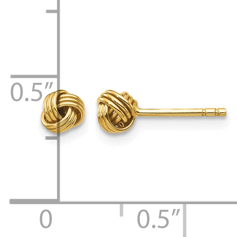Pair of gold twisted knot stud earrings displayed next to a ruler showing approximately 0.5 inches in size.