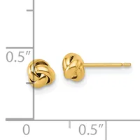 Pair of small gold twisted knot stud earrings shown next to a ruler indicating they measure approximately 0.5 inches in length.