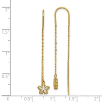 Three gold-toned threader earrings displayed against a ruler showing measurements up to two inches, featuring a star charm, a cylindrical charm, and a plain design.
