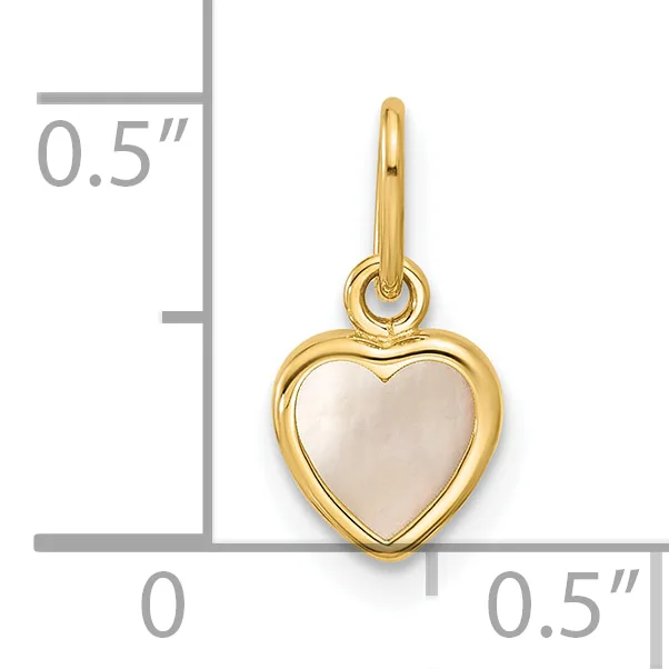 A gold heart pendant with a mother-of-pearl center and attached bail, shown next to a ruler indicating approximately half an inch in height and width.