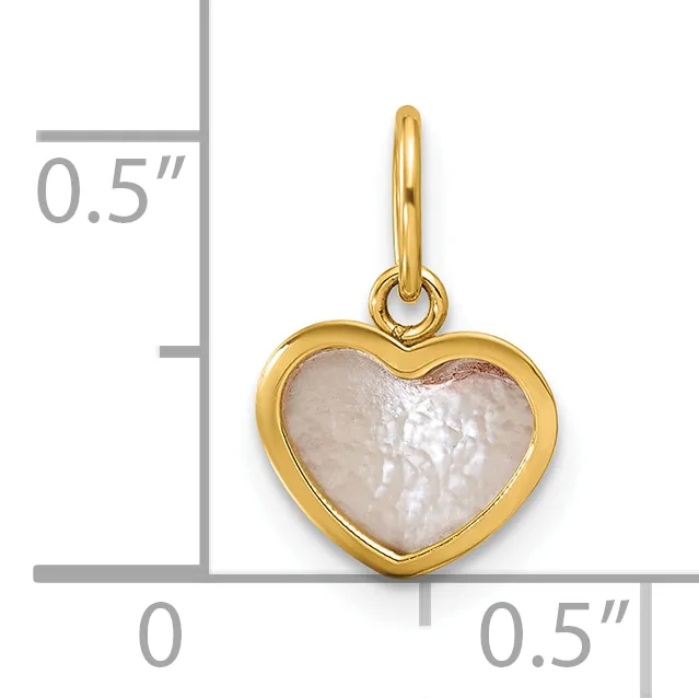 Gold-toned heart-shaped pendant with mother-of-pearl center and attached bail, shown next to a ruler indicating approximately 0.5 inches in width and height.