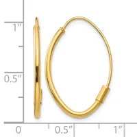 A pair of gold oval hoop earrings with a polished finish, shown from the front and side view with a measurement scale indicating they are approximately one inch tall and half an inch wide.
