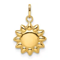 A gold sun-shaped pendant with a smooth circular center surrounded by pointed rays, suspended from a gold bail with a small loop attachment.