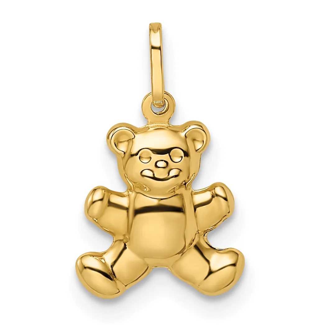 A polished gold teddy bear pendant with a smiling face and bow tie, suspended from a gold bail loop.