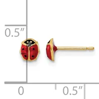 A pair of gold-colored ladybug stud earrings with red enamel wings and black spots, shown front and side view against a measurement scale.