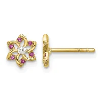 Pair of gold stud earrings featuring a four-petal flower design with a white diamond center stone and pink sapphires set in the curved petals, shown from front and side views.