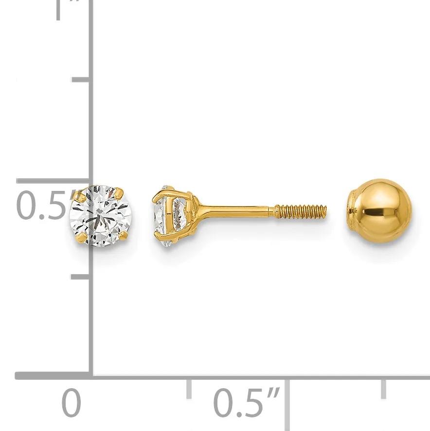 Two yellow gold stud earrings with screw backs displayed next to a ruler, one featuring a round clear gemstone and one a polished gold ball.