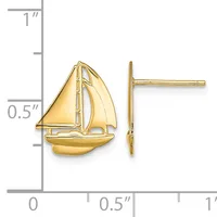 Gold sailboat stud earrings shown front and side view next to a ruler measuring approximately one inch tall.