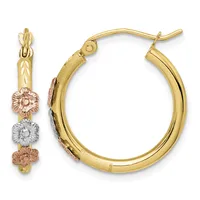 Pair of gold hoop earrings with tri-color floral charms in yellow, rose, and white gold, shown from front and side views.